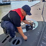 Thickness gauge during the application on a submarine.